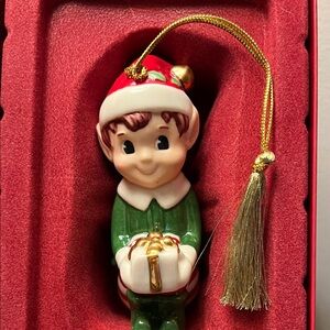 Lenox Elf Ornament with Gold Accents holding a Gift Red Striped Pants Red Top